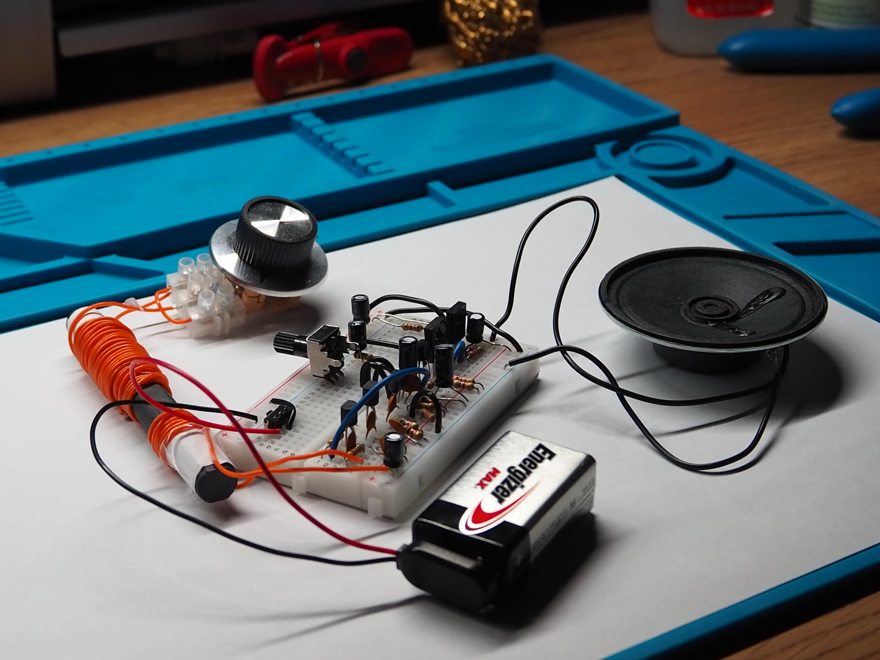 Angled view of the assembled AM radio on a work mat